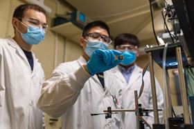 Researchers in the Sargent lab at Northwestern University examine their record-breaking perovskite solar cell. Photo: Sargent Lab/Northwestern University.