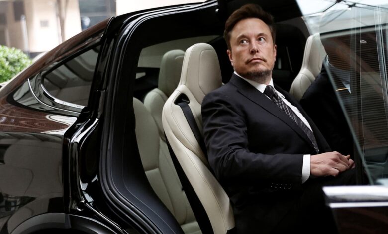 Tesla (TSLA) shares fall after Musk's EV maker warns of 2024 slowdown