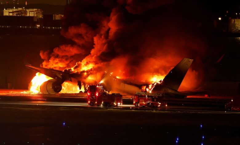 Japan Airlines plane in flames on runway at Tokyo airport